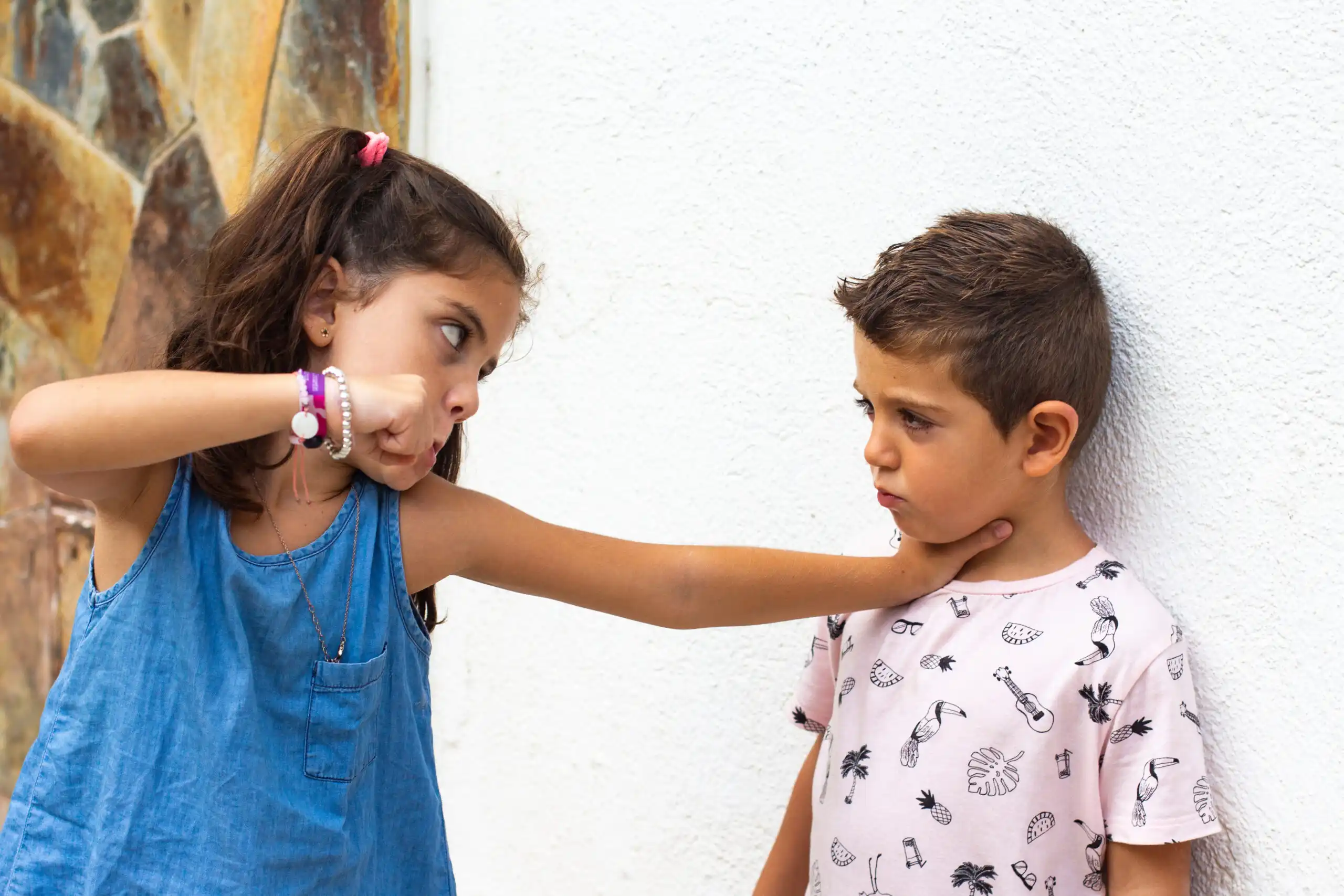 A girl bullying a boy