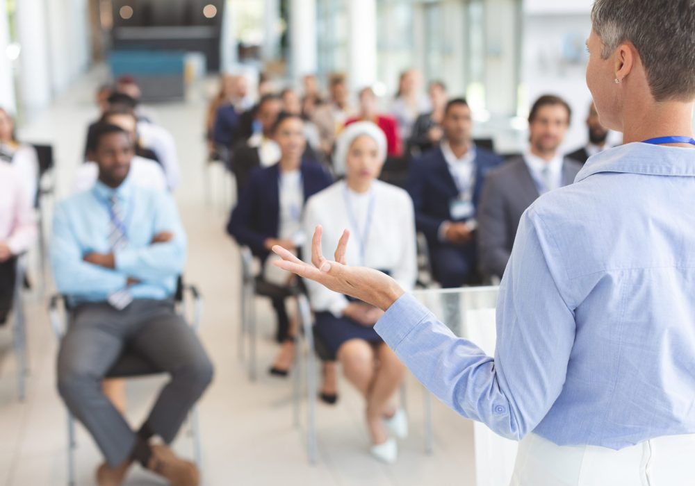 Female speaker speaks in a business seminar